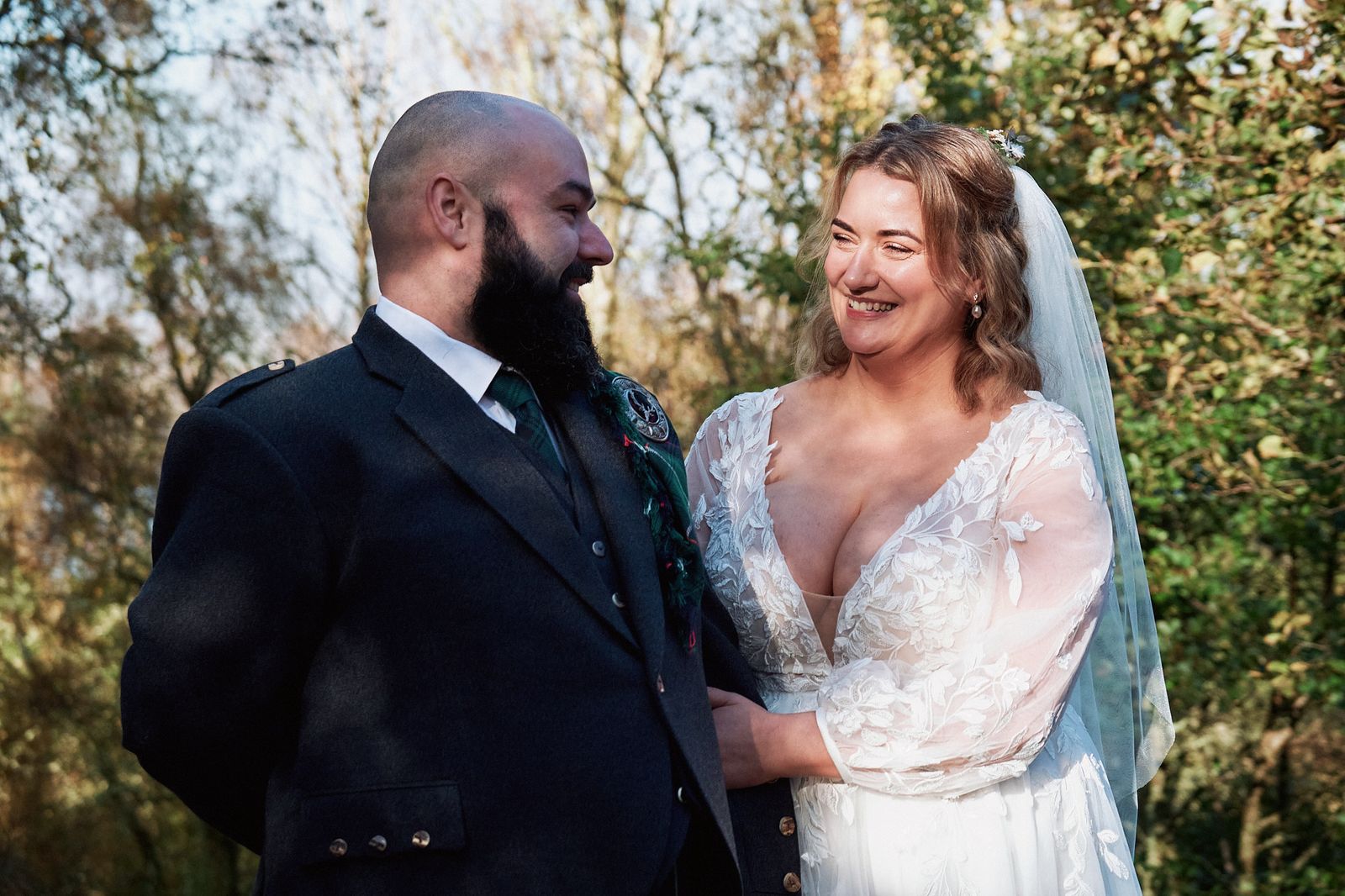 The couple laughing together during their Highland elopement ceremony